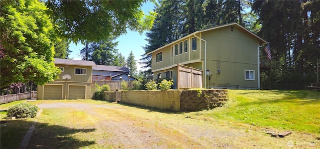 13837 Horsefall Ave SE, Rainier, WA 98576 - view of home's exterior with driveway and a garage