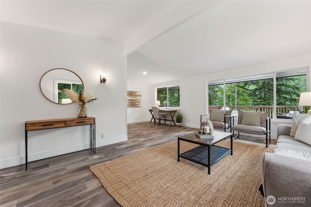 living room with lofted ceiling with beams, dark wood-style floors, and baseboards