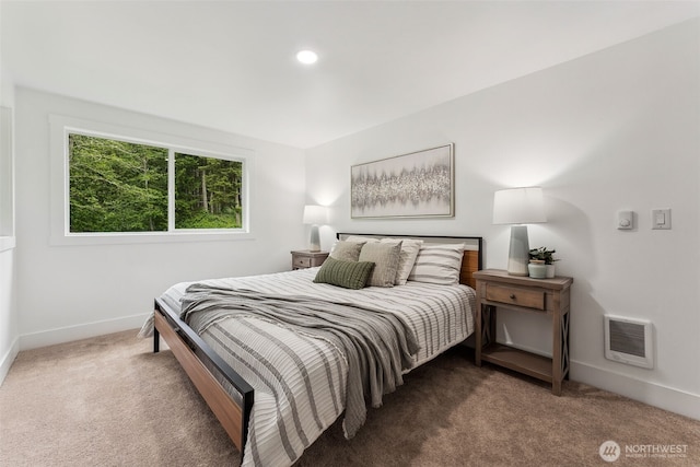 bedroom with carpet, visible vents, and baseboards