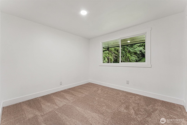 spare room with baseboards, carpet flooring, and recessed lighting