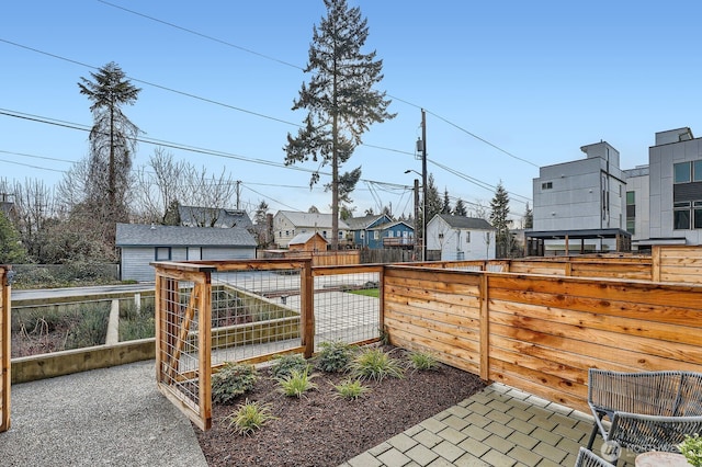 view of yard with a residential view and a fenced backyard