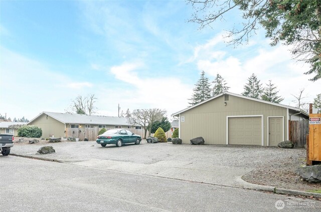 view of car parking featuring a detached garage