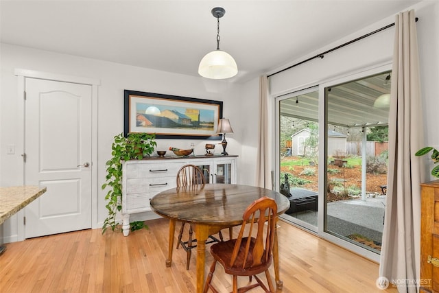 dining area with light wood-style flooring