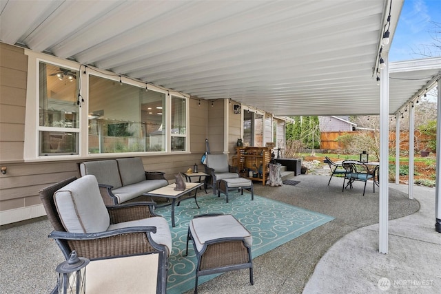 view of patio / terrace featuring an outdoor living space, outdoor dining space, and fence