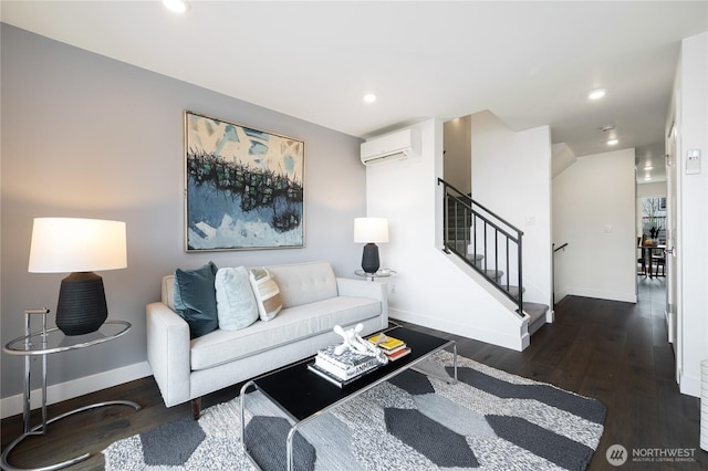 living room with recessed lighting, dark wood-type flooring, baseboards, stairs, and an AC wall unit