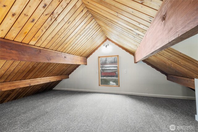 bonus room featuring lofted ceiling with beams, wooden ceiling, and carpet flooring