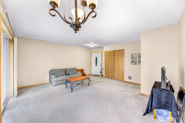 living area with baseboards, visible vents, a chandelier, and light colored carpet