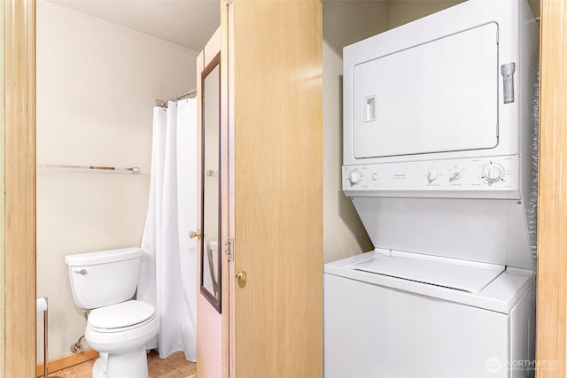 laundry area with stacked washer / drying machine