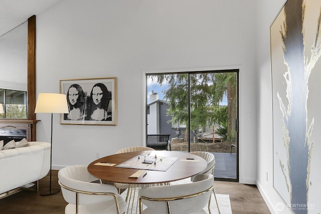 dining room with light wood-style flooring and baseboards