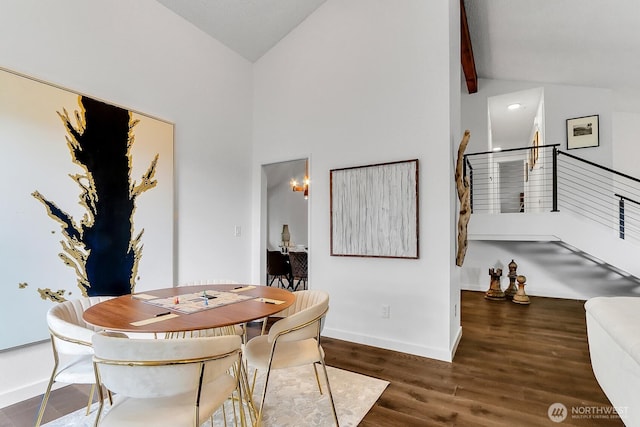 dining space with beam ceiling, stairway, wood finished floors, high vaulted ceiling, and baseboards