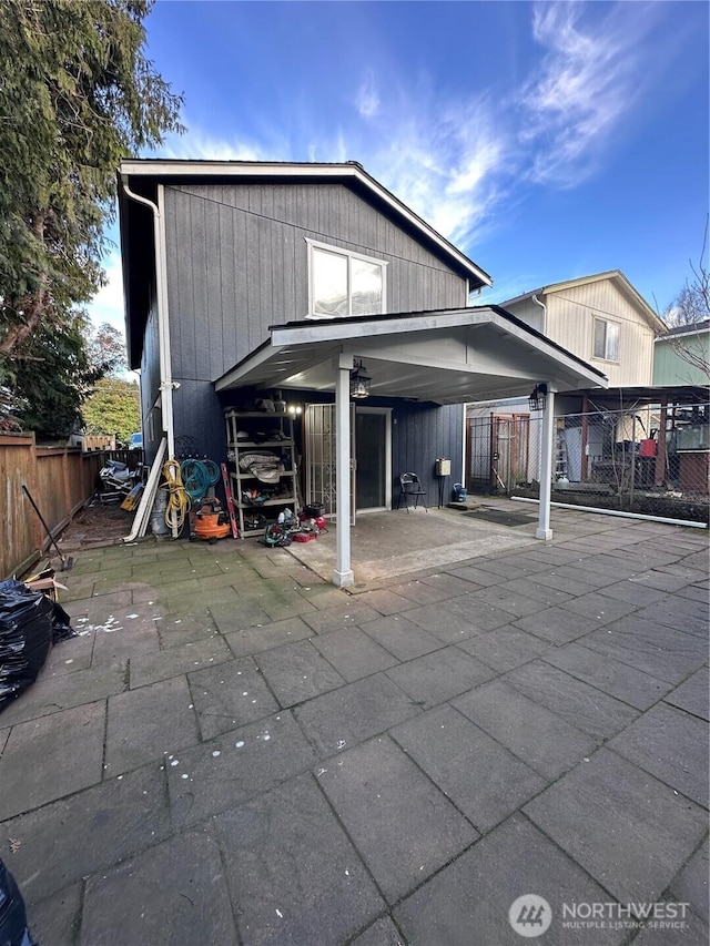 back of house with fence