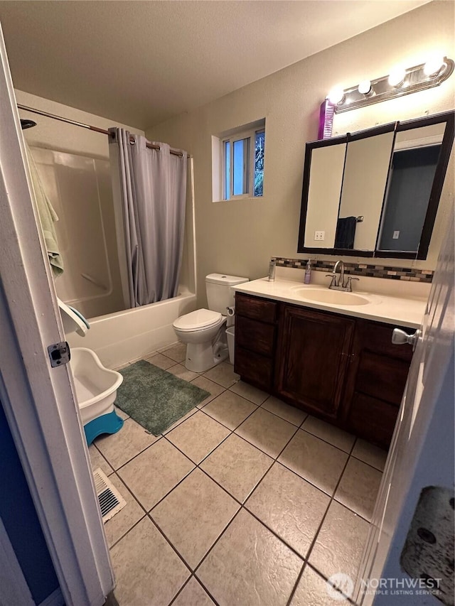 full bathroom with tile patterned flooring, visible vents, toilet, shower / bath combination with curtain, and vanity