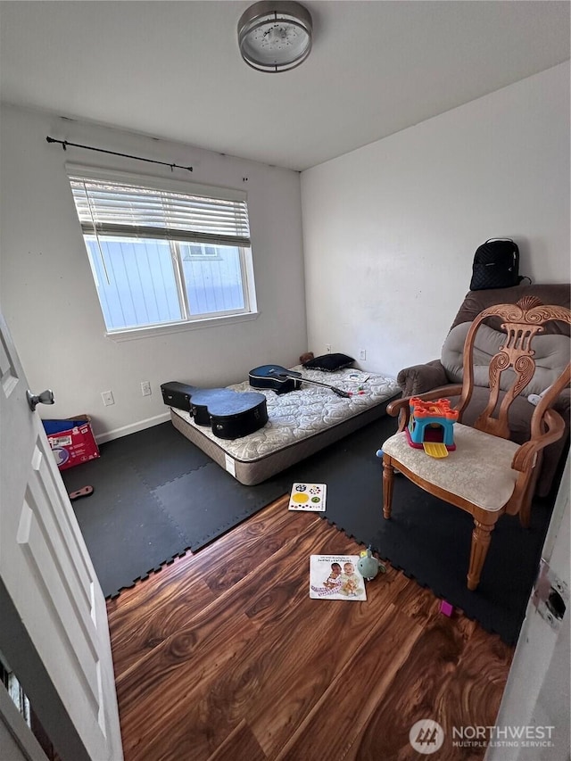 bedroom featuring baseboards