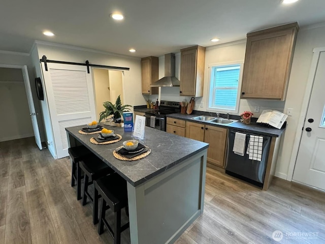 kitchen with a barn door, electric range, dishwasher, wall chimney exhaust hood, and dark countertops