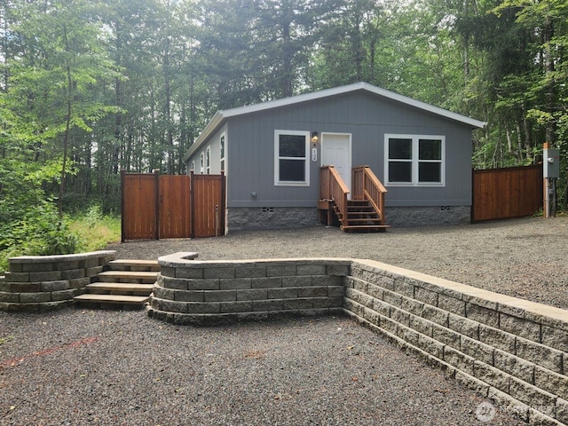 view of front of home featuring crawl space and entry steps