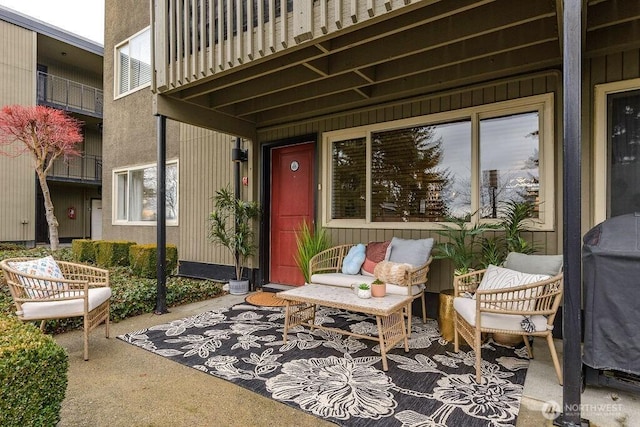 view of patio featuring a balcony