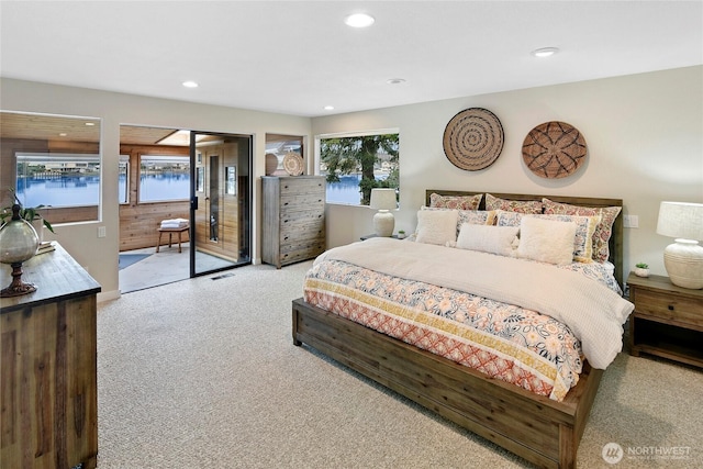 bedroom featuring recessed lighting, visible vents, access to exterior, and carpet flooring