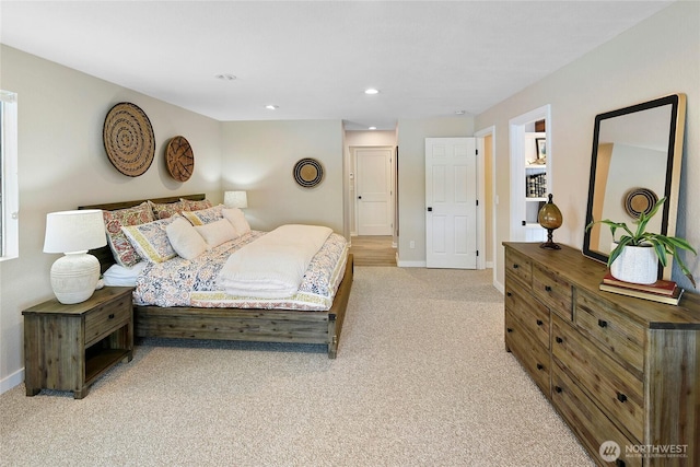 bedroom with recessed lighting, baseboards, and light colored carpet