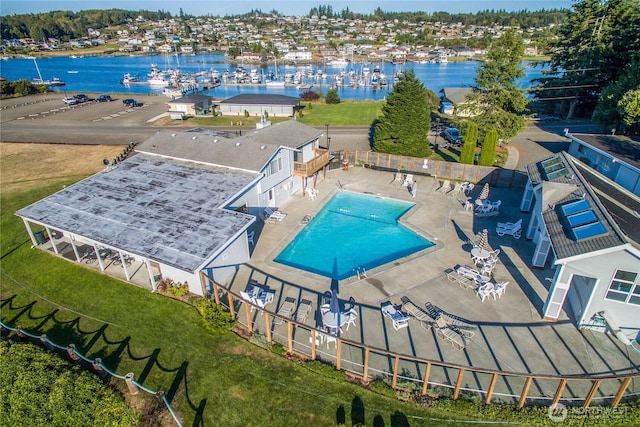 birds eye view of property with a water view