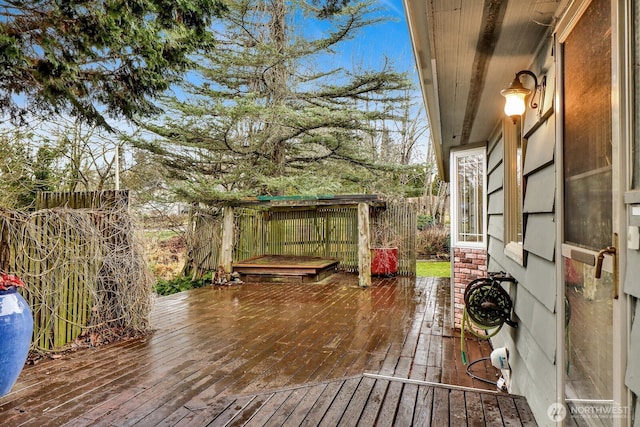 wooden deck featuring fence