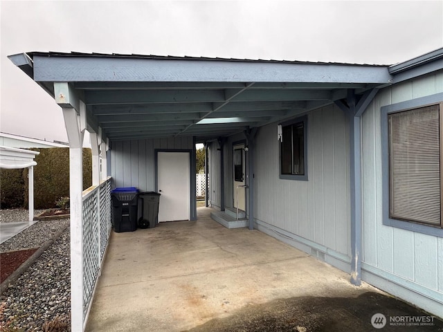 view of parking / parking lot with an attached carport