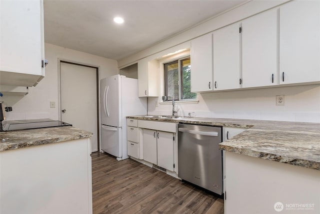 kitchen featuring white cabinetry, light countertops, stainless steel dishwasher, range, and dark wood finished floors