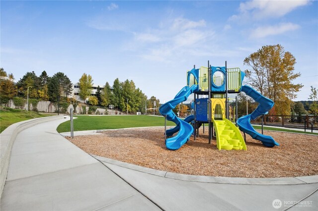 community jungle gym with a yard