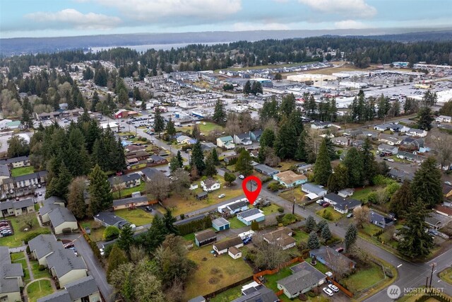 birds eye view of property with a residential view