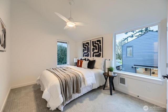 carpeted bedroom featuring vaulted ceiling, ceiling fan, visible vents, and baseboards