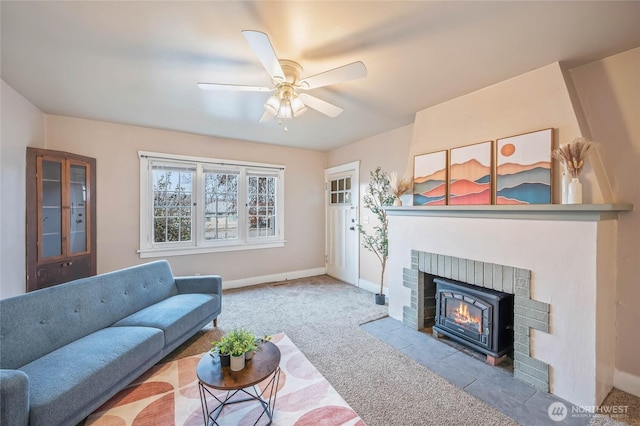 living area featuring ceiling fan, carpet, and baseboards