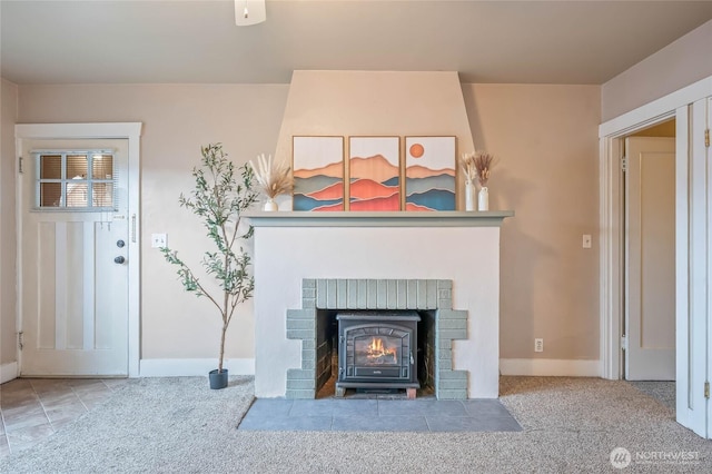 living area featuring carpet flooring and baseboards