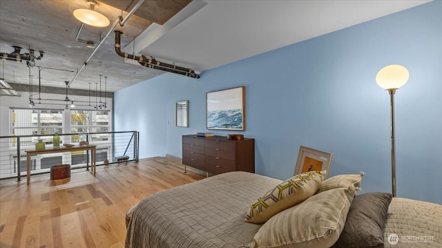 bedroom with wood finished floors