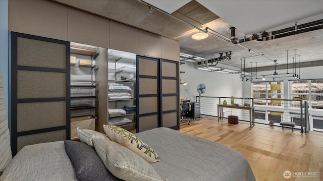 bedroom with wood finished floors