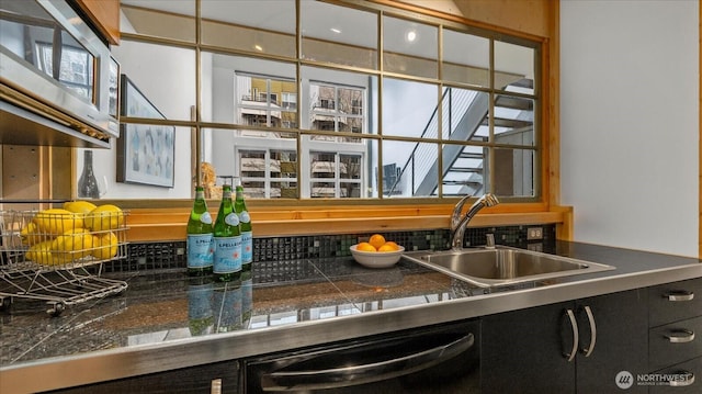 details featuring tile countertops, a sink, dishwasher, and decorative backsplash