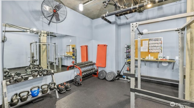 workout area with a garage