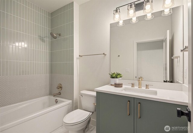 bathroom featuring shower / bathing tub combination, vanity, and toilet