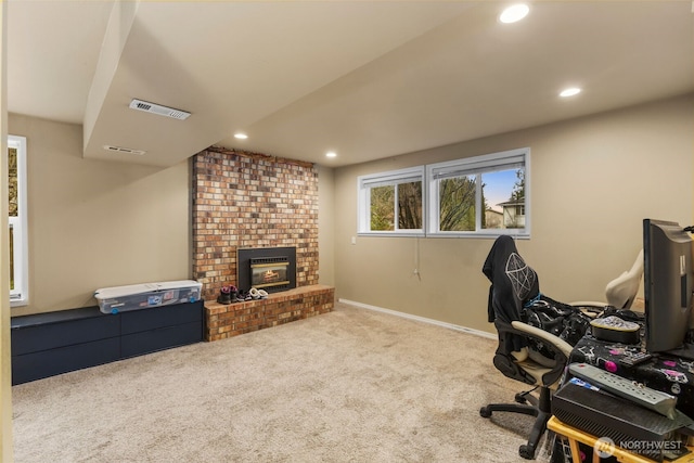 office area with recessed lighting, light colored carpet, visible vents, a brick fireplace, and baseboards