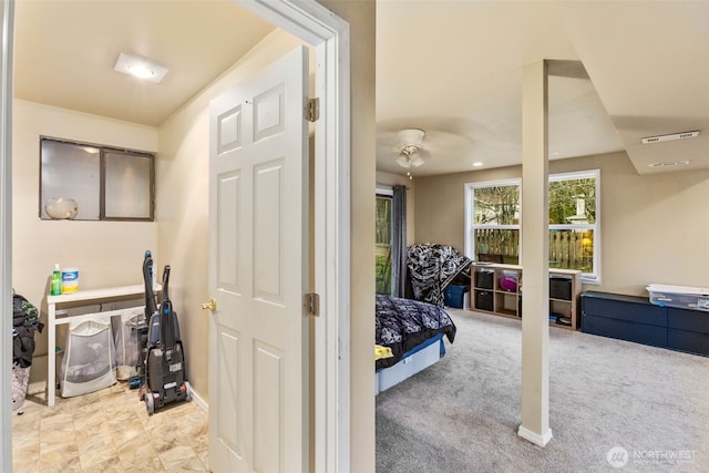 interior space with visible vents and light colored carpet