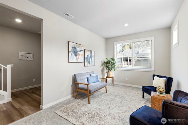 sitting room with stairway, baseboards, visible vents, and recessed lighting