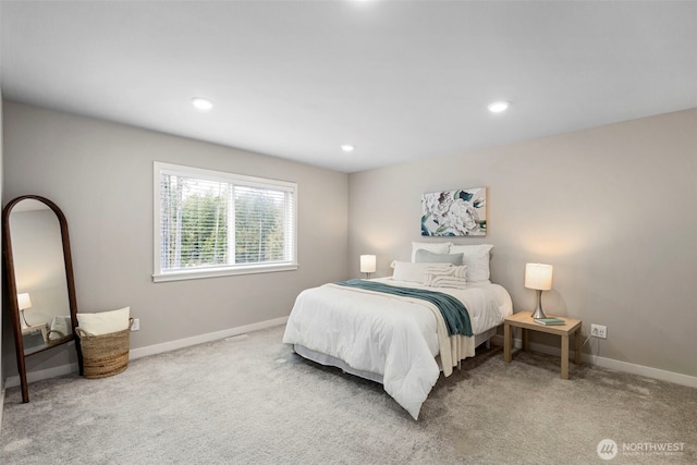 carpeted bedroom featuring baseboards and recessed lighting