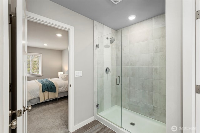 full bath featuring a stall shower, recessed lighting, ensuite bath, and baseboards