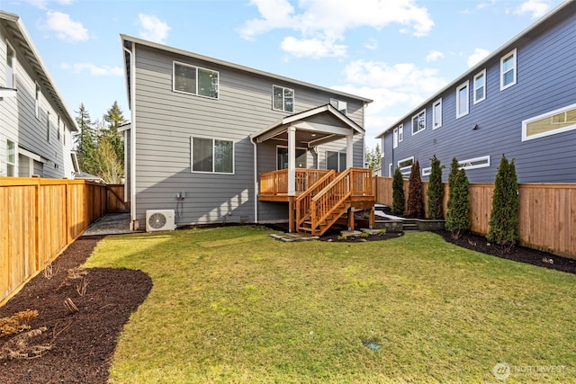 back of property featuring ac unit, a fenced backyard, stairs, and a lawn