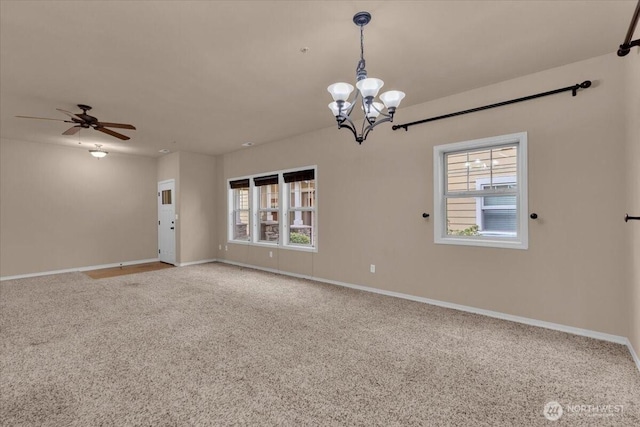 carpeted empty room with plenty of natural light and baseboards