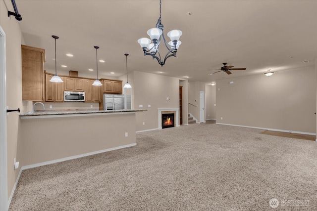 unfurnished living room featuring baseboards, ceiling fan, carpet floors, a sink, and recessed lighting