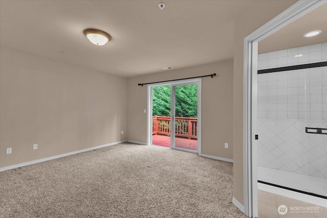 carpeted empty room with baseboards