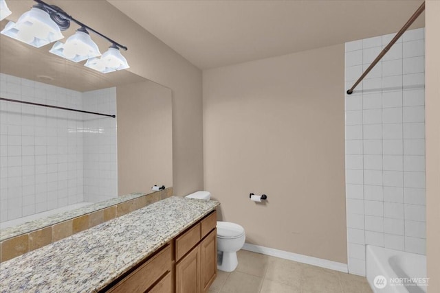 full bath with tile patterned flooring, toilet, vanity, baseboards, and shower / washtub combination