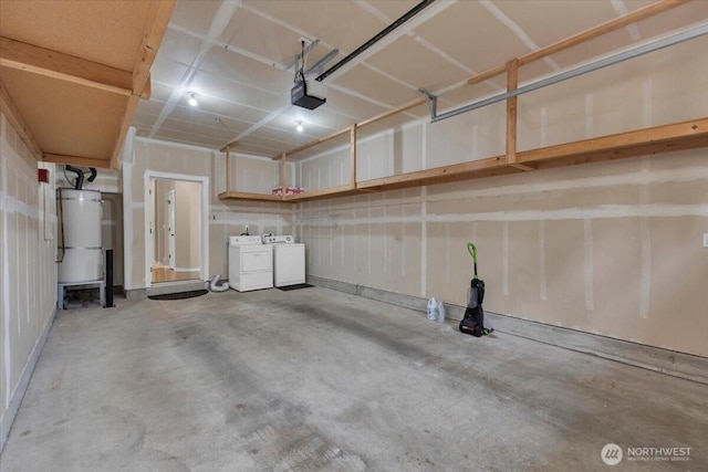 garage with a garage door opener, washing machine and dryer, and water heater