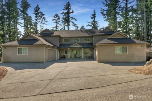 view of front of house featuring a garage and concrete driveway