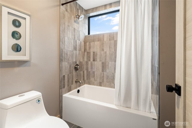 full bath with toilet and shower / bath combo with shower curtain