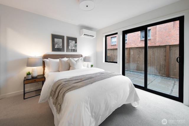 bedroom featuring light carpet, access to outside, baseboards, and a wall mounted AC